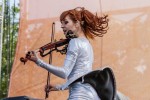 File Photo: Lindsey Stirling in concert in 2015, at the Bunbury Festival in Cincinnati, Ohio. Used by permission. (Photo Credit: Larry Philpot, soundstagephotography.com)