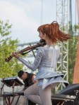 File Photo: Lindsey Stirling in concert in 2015, at the Bunbury Festival in Cincinnati, Ohio. Used by permission. (Photo Credit: Larry Philpot, soundstagephotography.com)