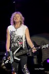 File Photo: Rick Savage of Def Leppard performing in Noblesville, Indiiana, 2016. Used with Permission. (Photo Credit: Larry Philpot)